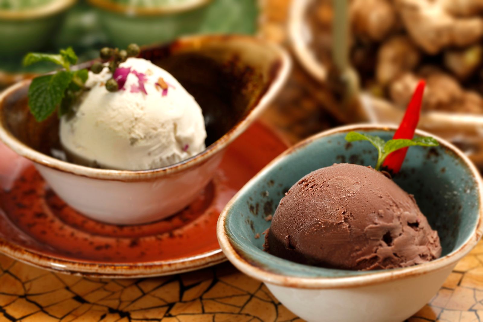 Artisan vanilla and chocolate ice cream scoops in rustic bowls